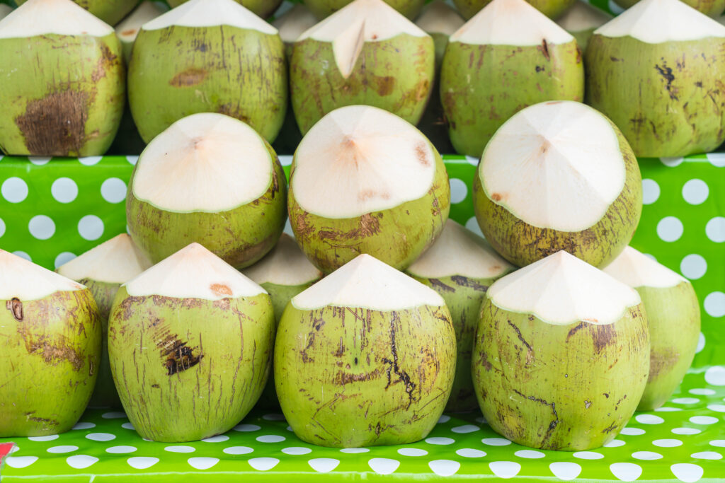 fresh coconuts on shelf